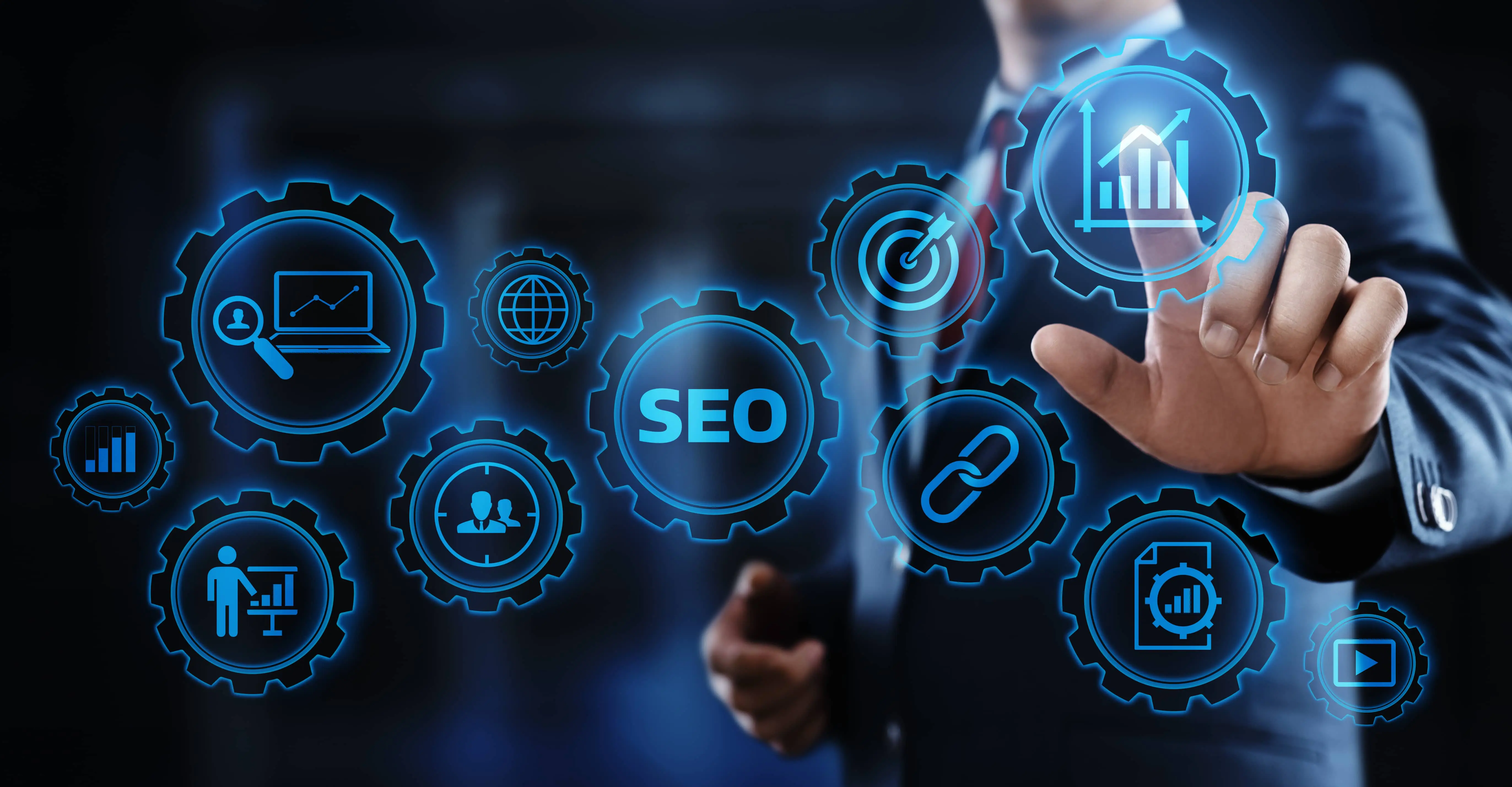 Man in a suit touches a glowing blue gear icon, among gears marked "SEO", a chain link, a target and analytics charts.