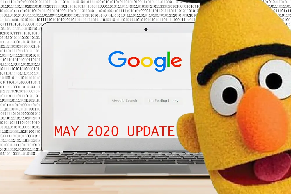 Laptop showing Google's search page with red text "May 2020 Update", a yellow puppet with a black unibrow beside it and binary code behind.