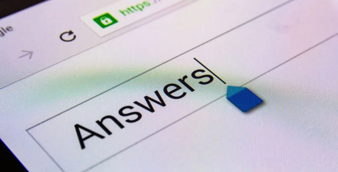 Extreme close-up of a browser search box on screen with the word "Answers" typed into it and the https padlock in the address bar